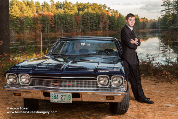 Senior portraits of guy in a suit with a classic car